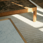 Modern designer coffee tables with wooden frames and marble tops