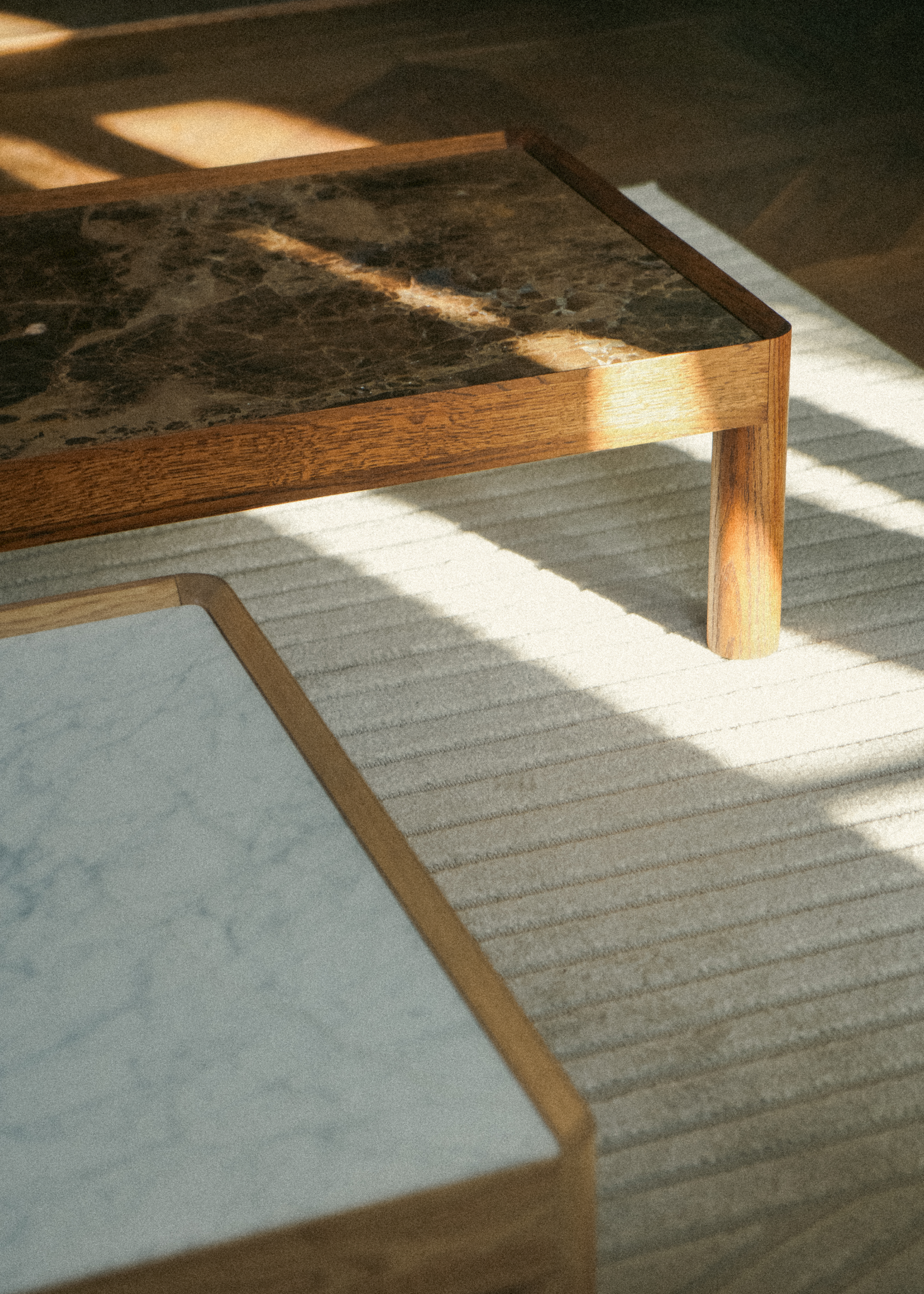 Modern designer coffee tables with wooden frames and marble tops